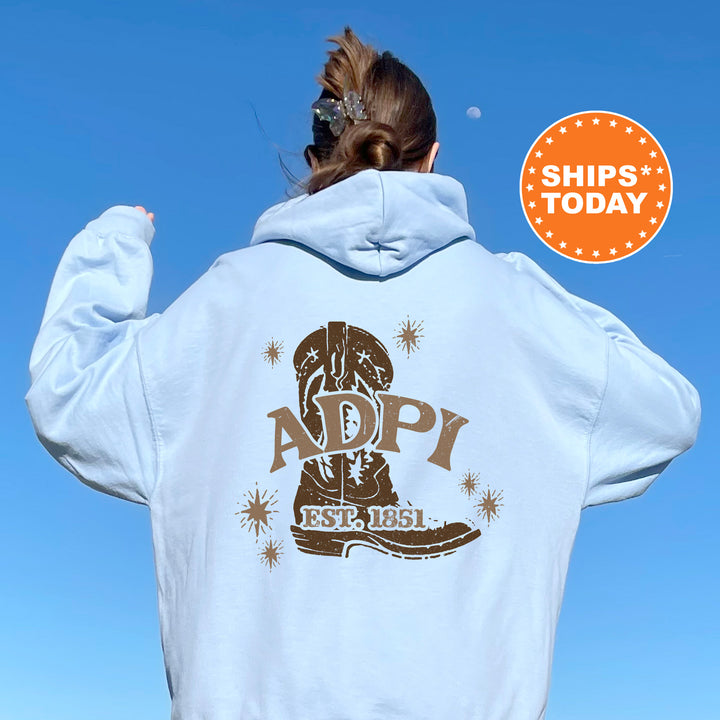 a woman with her back to the camera wearing a white hoodie