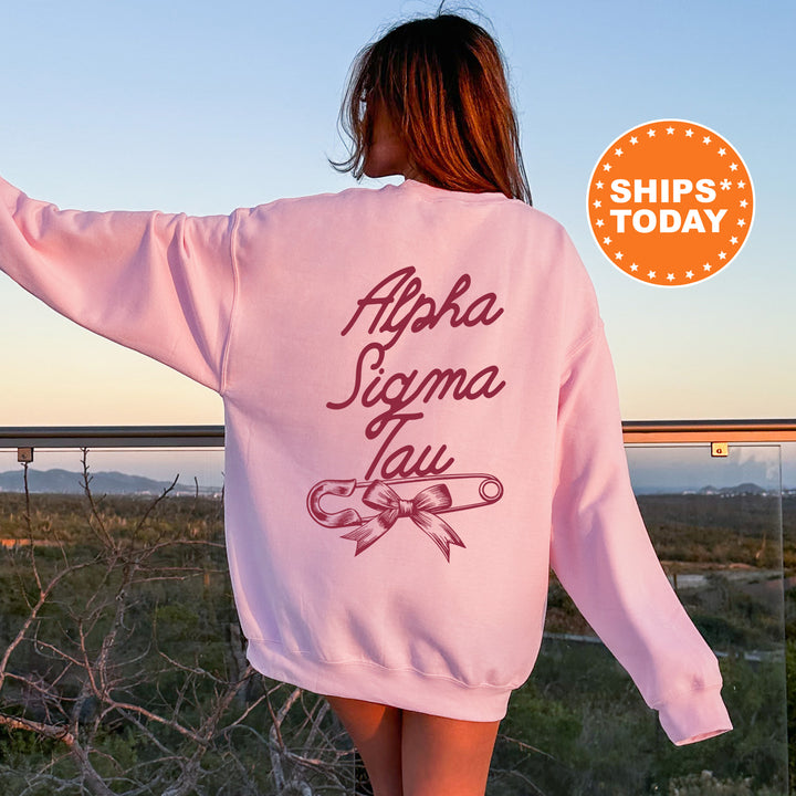 a woman wearing a pink sweatshirt with writing on it