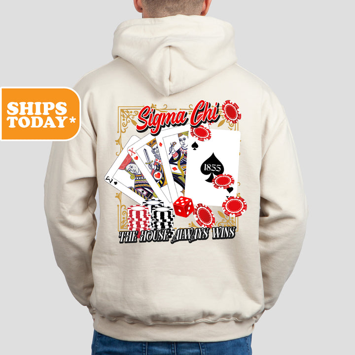 a man wearing a white hoodie with a picture of a playing card on it