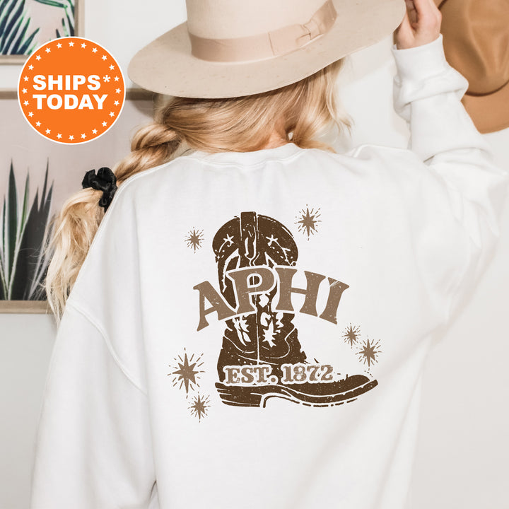 a woman wearing a white shirt with a cowboy boot on it