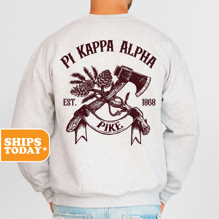 a man wearing a sweatshirt that says pj kappa alpha