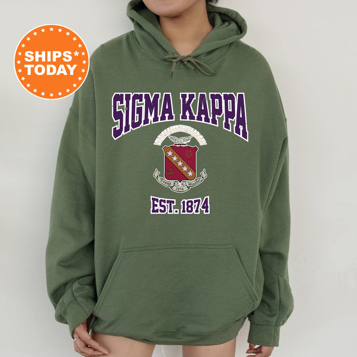 a woman wearing a green hoodie with the words sigma kappa