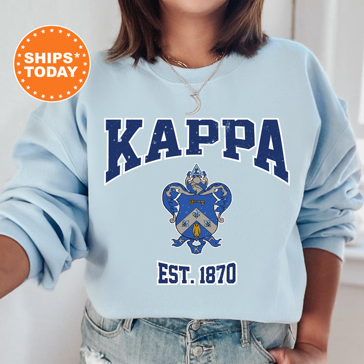 a woman wearing a blue sweatshirt with the words kappa on it