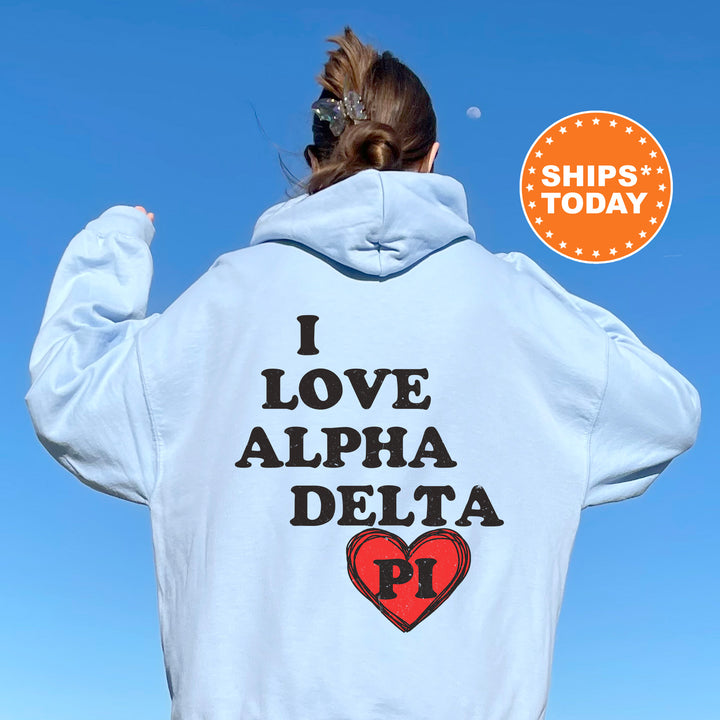 a woman with her back to the camera wearing a white hoodie that says i