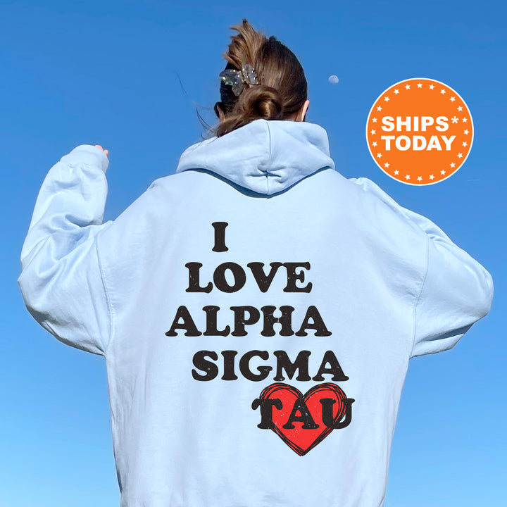 a woman with her back to the camera wearing a white hoodie that says i