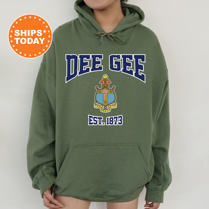 a person wearing a green hoodie with a blue and yellow crest on it