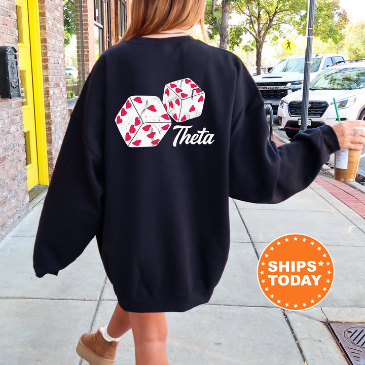 a woman walking down a sidewalk wearing a black sweatshirt