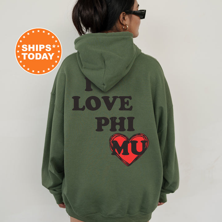 a woman wearing a green hoodie with a heart on it