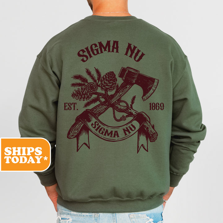 a man wearing a green sweatshirt with a hammer and pine cones on it