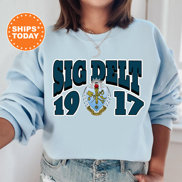 a woman wearing a blue sweatshirt with the words, sig diet 19 17