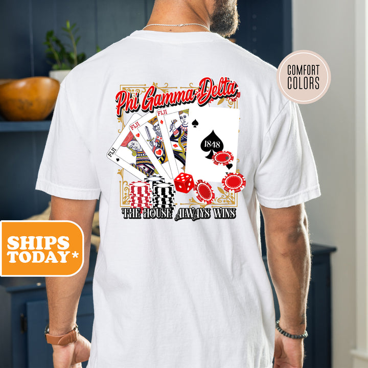 a man wearing a white shirt with a picture of playing cards on it