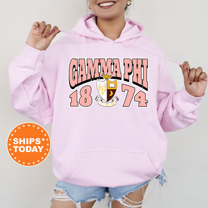 a woman wearing a pink hoodie with the words gummapui on it
