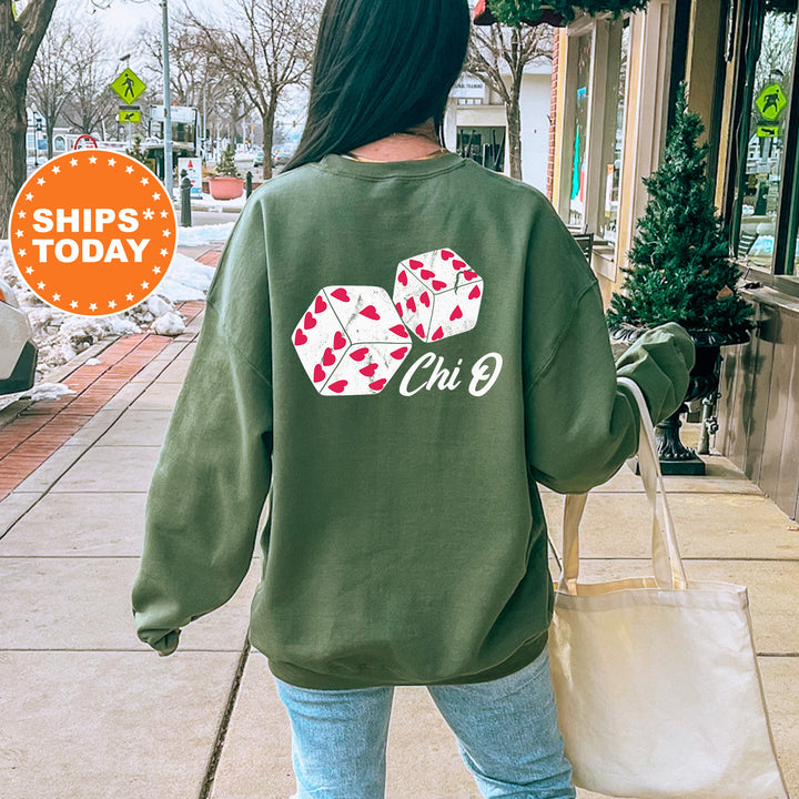 a woman walking down a sidewalk carrying a shopping bag
