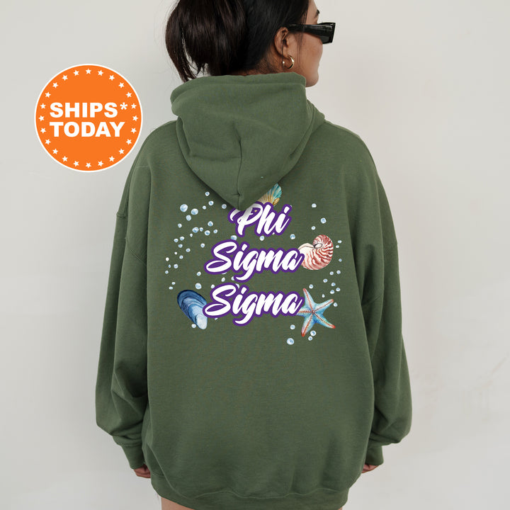 a woman wearing a green sweatshirt with the words phi sigma sigma