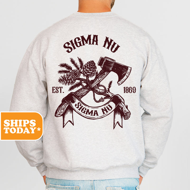 a man wearing a sweatshirt with a hammer and pine cones on it