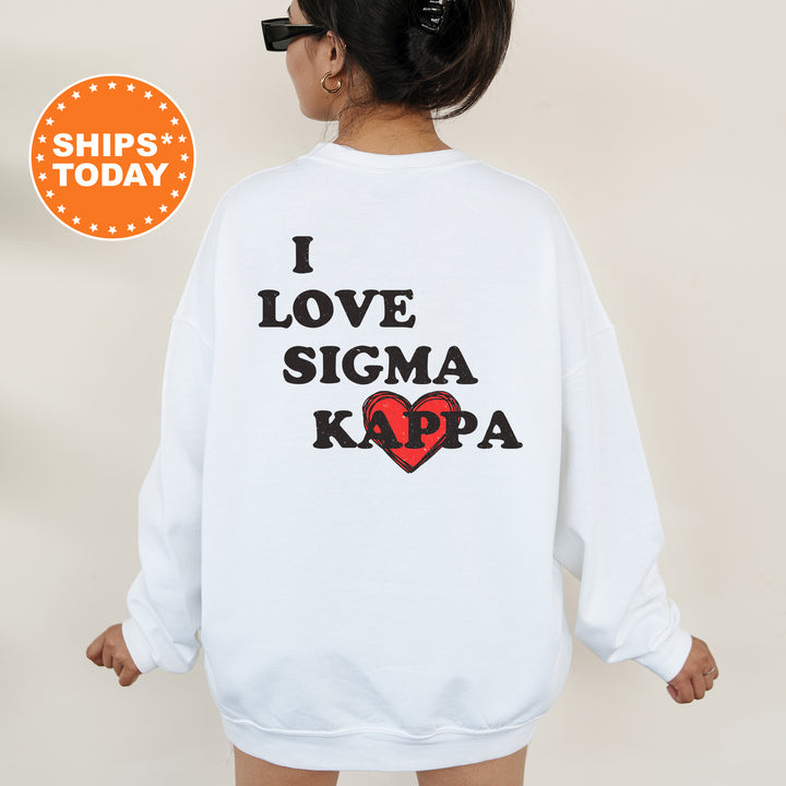 a woman wearing a sweatshirt that says i love stigma kapa