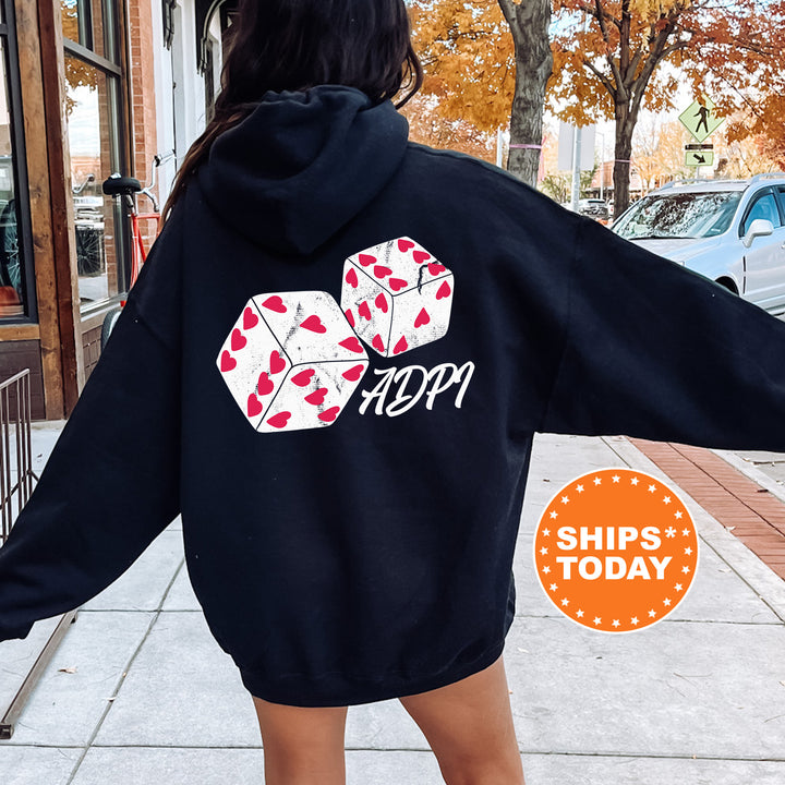 a woman in a black hoodie is walking down the street