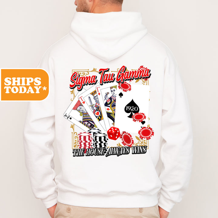 a man wearing a white hoodie with a picture of playing cards on it