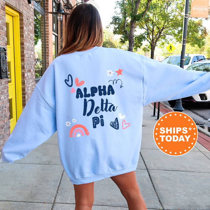 a woman walking down a sidewalk wearing a blue sweatshirt
