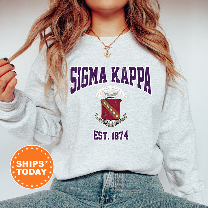 a woman with long hair wearing a sweatshirt and jeans