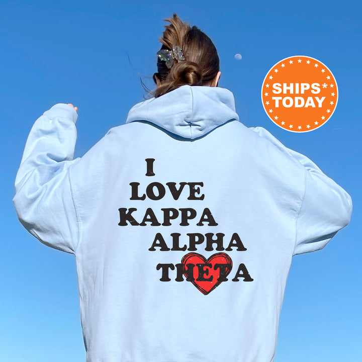 a woman with her back to the camera wearing a hoodie that says i love