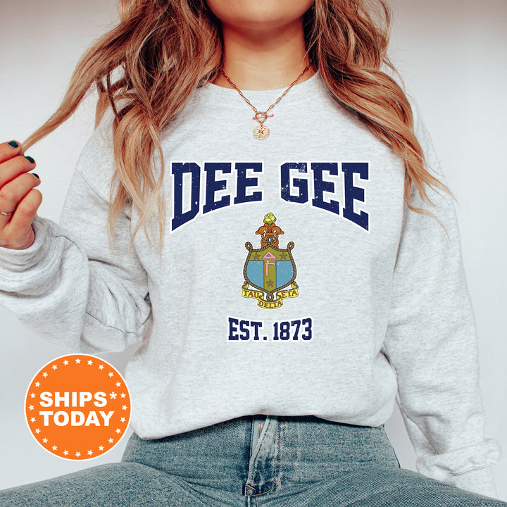 a woman wearing a sweatshirt with a crest on it