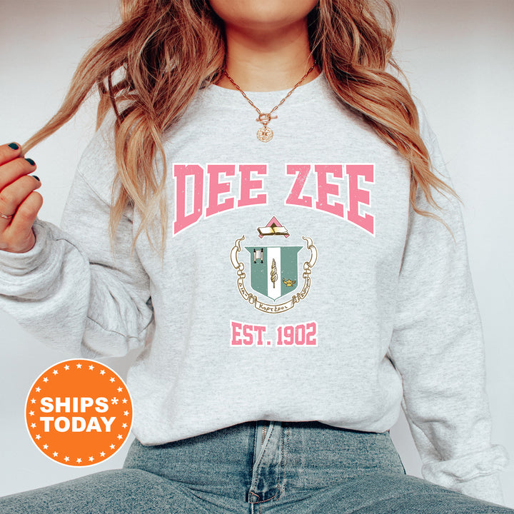 a woman wearing a sweatshirt that says dee zeee est 1932