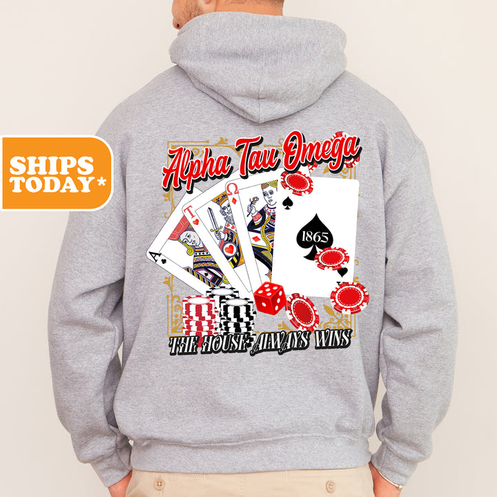 a man wearing a gray hoodie with a picture of playing cards on it