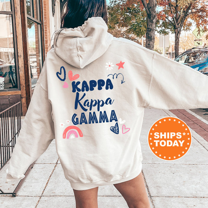 a woman walking down a sidewalk wearing a white hoodie