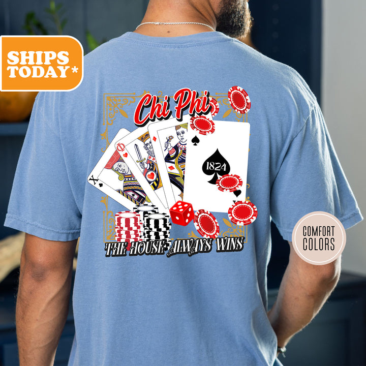 a man wearing a blue shirt with a picture of playing cards