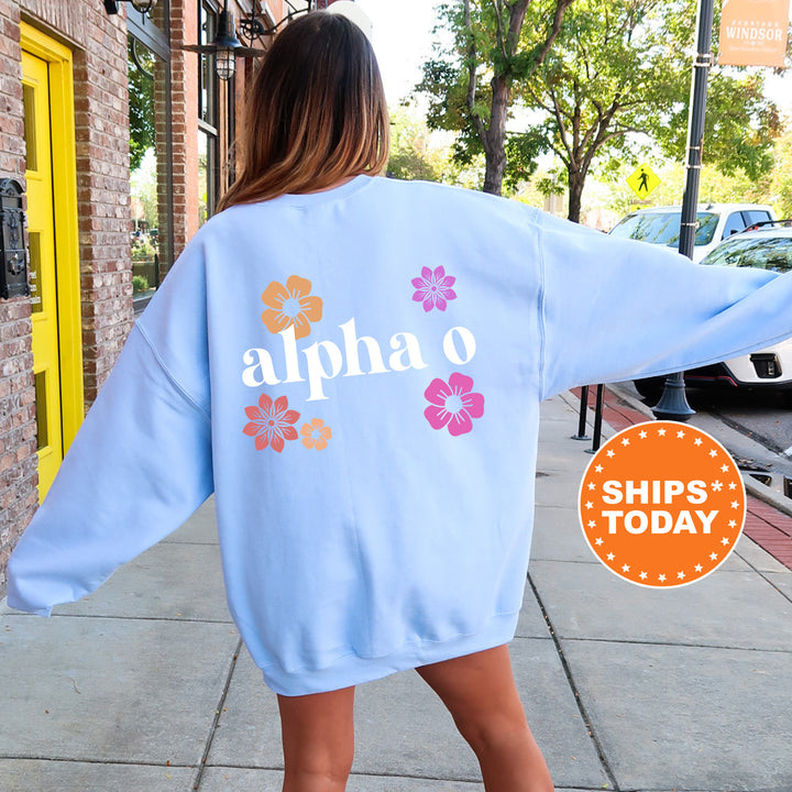 a woman walking down a sidewalk wearing a blue sweatshirt