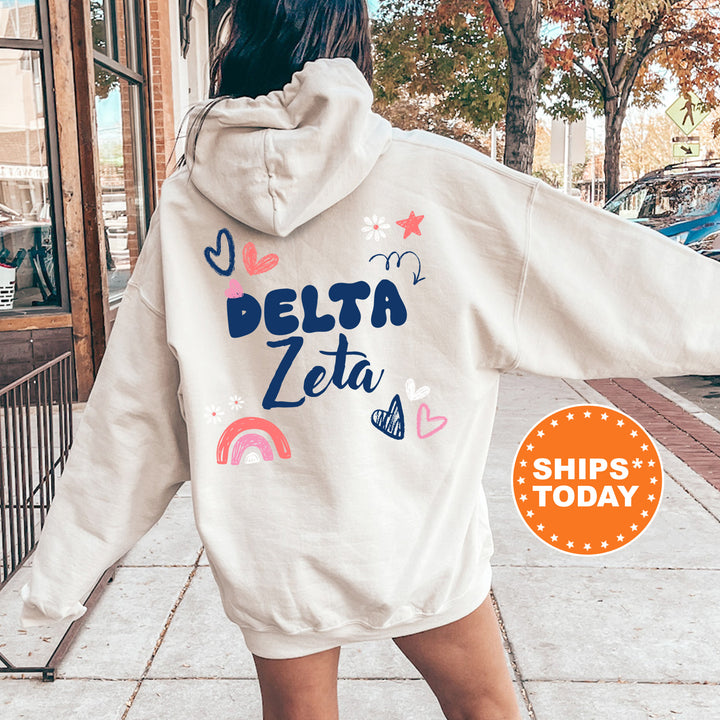 a woman walking down a sidewalk wearing a white hoodie