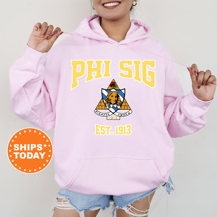 a woman wearing a pink phi sig hoodie