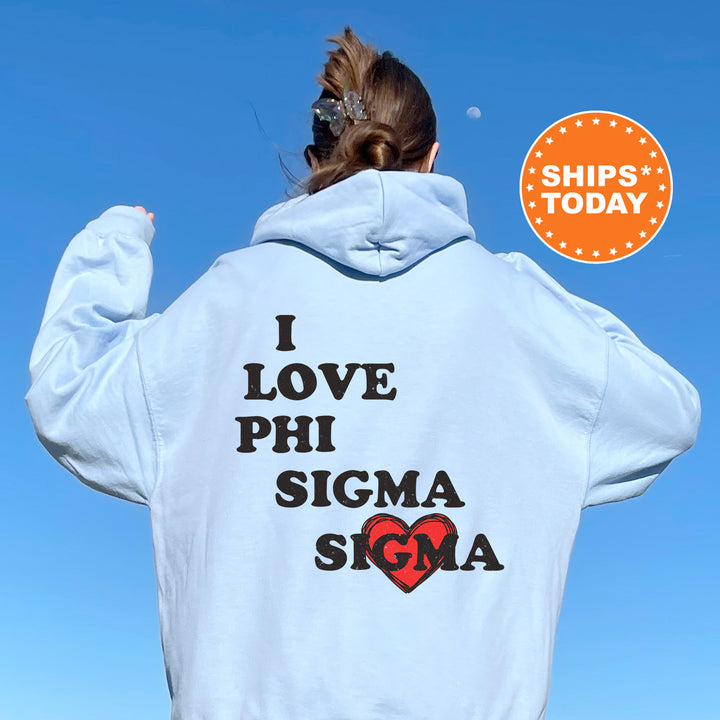 a woman wearing a white hoodie that says i love phi sigma