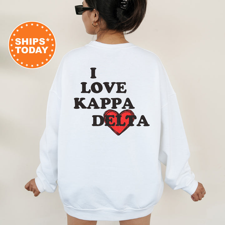 a woman wearing a sweatshirt that says i love kapaa dola
