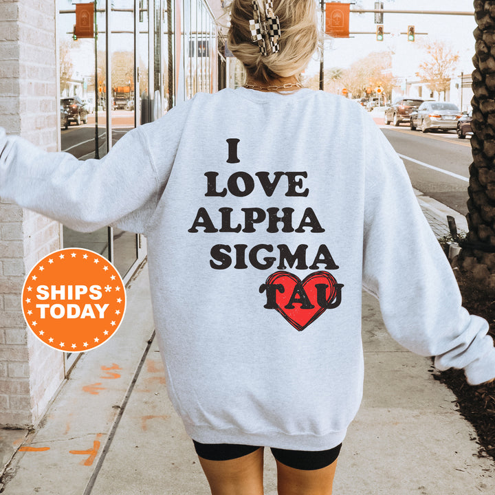 a woman walking down a sidewalk wearing a sweatshirt