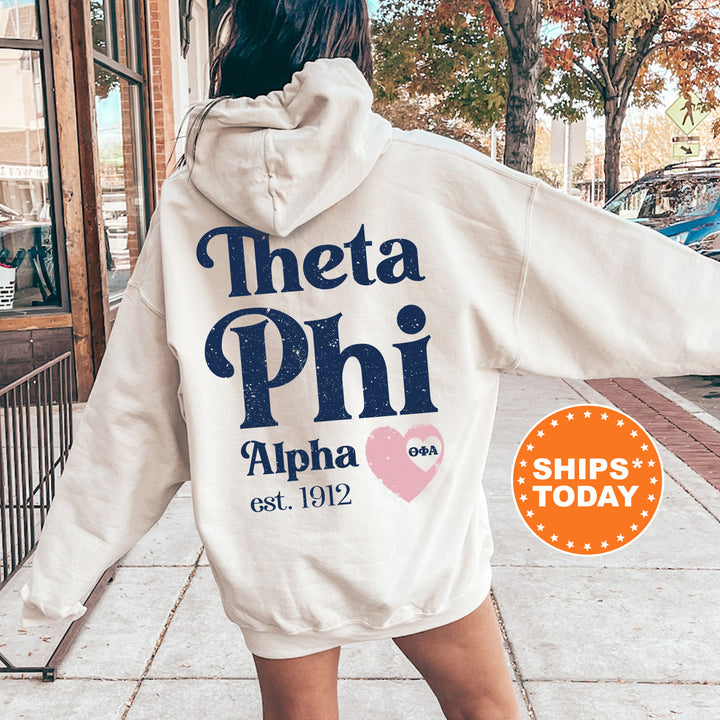 a woman in a white hoodie is walking down the street