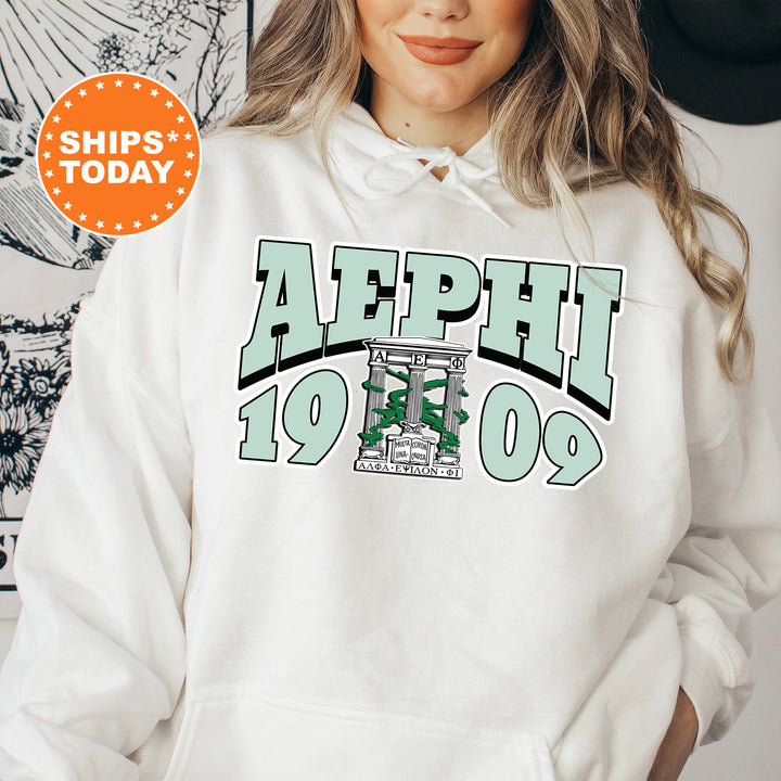 a woman wearing a white hoodie with the words alphi on it