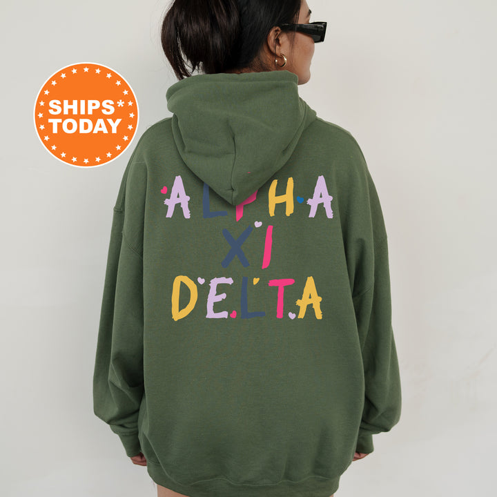 a woman wearing a green hoodie with the words aha delta printed on it