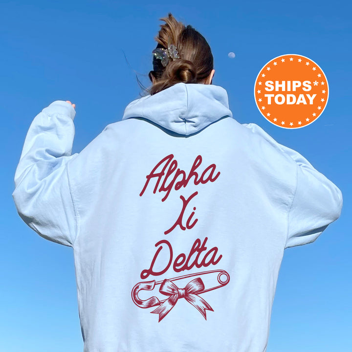 a woman wearing a white hoodie with a red logo on it
