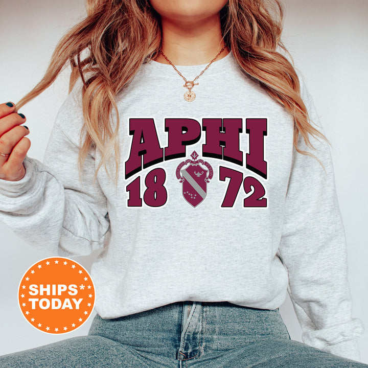 a woman wearing a sweatshirt with the words april on it