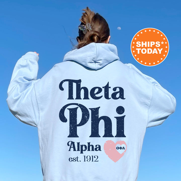 a woman with her back to the camera wearing a white hoodie