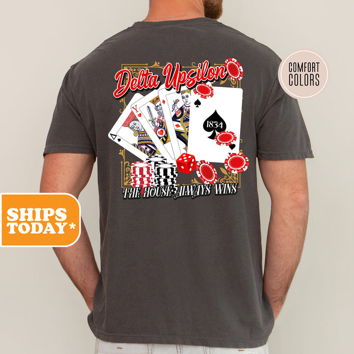 a man wearing a shirt with a picture of playing cards on it