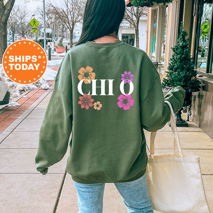 a woman walking down a sidewalk carrying a shopping bag