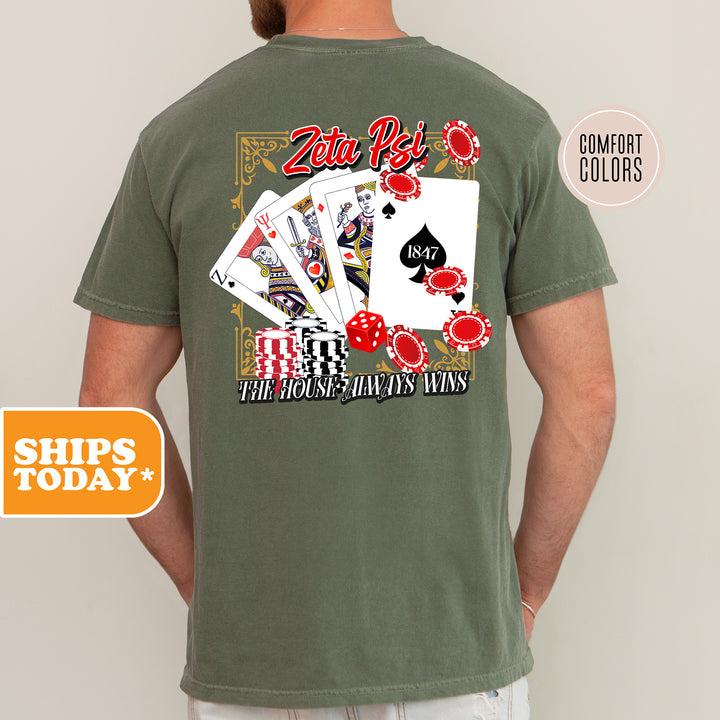 a man wearing a t - shirt with a picture of playing cards on it