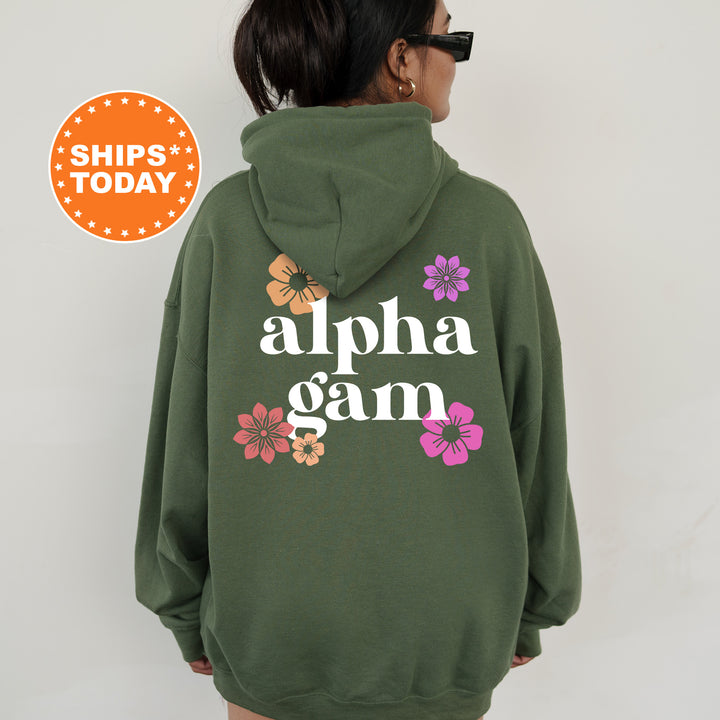 a woman wearing a green hoodie with the words, alpha gam on it