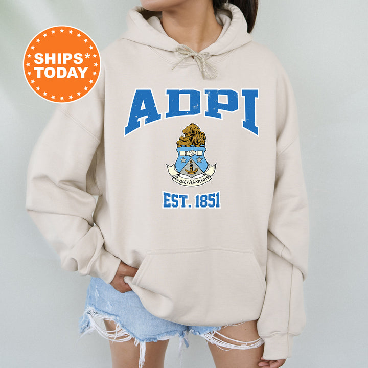 a woman wearing a white hoodie with an adpi seal on it