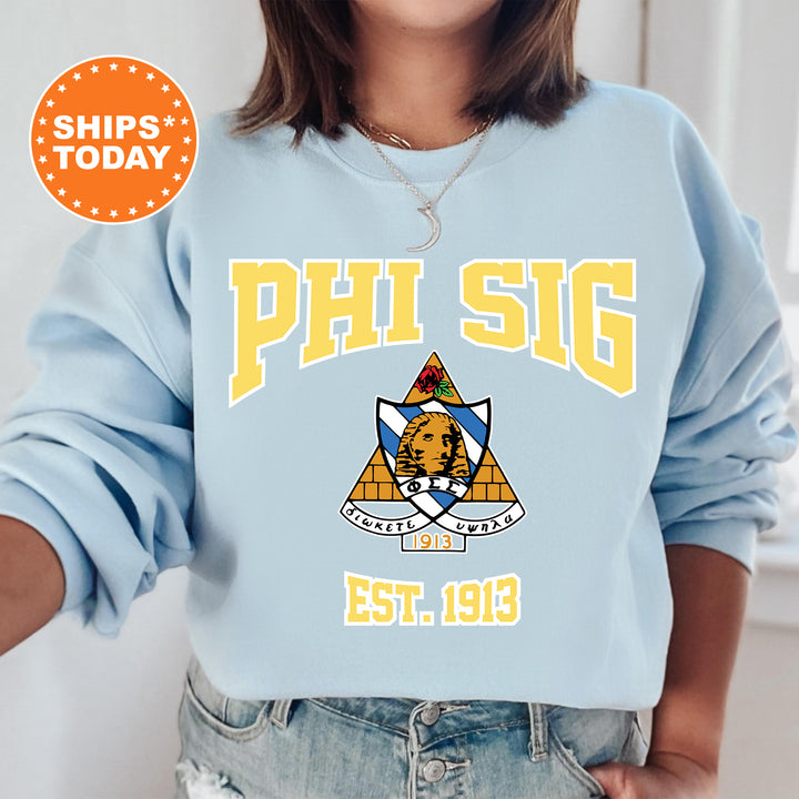 a woman wearing a blue phi sig sweatshirt