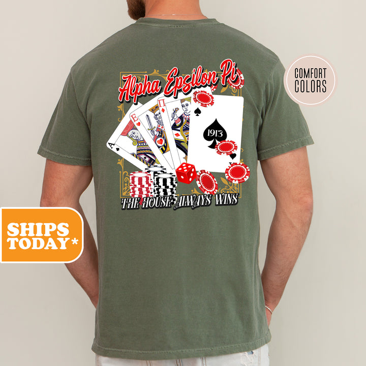 a man wearing a green shirt with playing cards on it