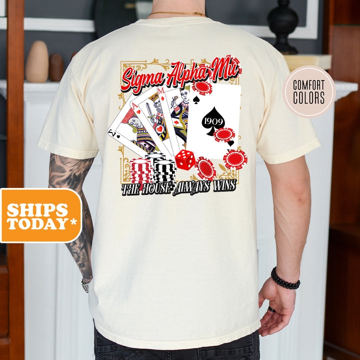 a man wearing a t - shirt with a picture of playing cards on it
